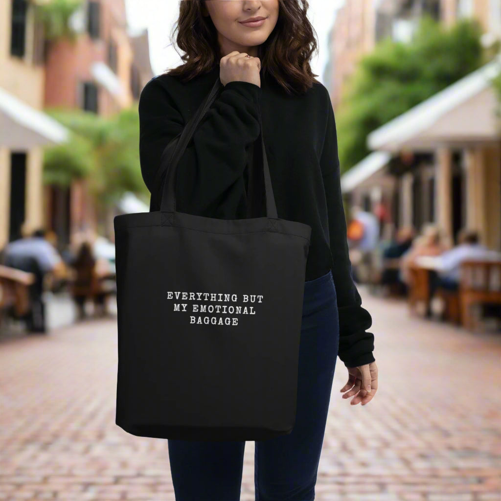 Woman holding a black colored eco tote bag